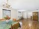 Formal dining room featuring chandelier, wood floors, and window at 1813 Kingsley Dr, Anderson, IN 46011