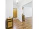 Hallway with wood floors, coat closet, and decorative furnishings at 1813 Kingsley Dr, Anderson, IN 46011