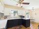 Cozy kitchen with dark cabinets, white countertops, and modern appliances at 1813 Kingsley Dr, Anderson, IN 46011