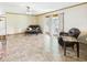 Living room with tile floors, sliding glass doors, and seating area at 1813 Kingsley Dr, Anderson, IN 46011