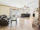 Spacious living room with fireplace, tile floor, and access to a sunroom at 1813 Kingsley Dr, Anderson, IN 46011