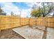 Private backyard gate with concrete patio area, surrounded by a brand new wooden fence at 1921 N Dexter St, Indianapolis, IN 46202