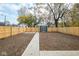 Spacious backyard featuring a storage shed and a new wooden fence for privacy and security at 1921 N Dexter St, Indianapolis, IN 46202