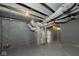 Basement showing pipes, ductwork, and painted floor at 1921 N Dexter St, Indianapolis, IN 46202