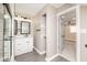 Bathroom featuring a shower, vanity with sink, and convenient access to the bedroom at 1921 N Dexter St, Indianapolis, IN 46202