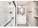 Clean bathroom featuring glass shower door, stylish vanity, and good lighting at 1921 N Dexter St, Indianapolis, IN 46202