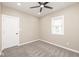 An empty bedroom featuring neutral walls, carpet, a ceiling fan, and a sun-filled window at 1921 N Dexter St, Indianapolis, IN 46202