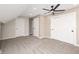 Spacious carpeted bedroom featuring a ceiling fan, closet, and neutral color scheme at 1921 N Dexter St, Indianapolis, IN 46202