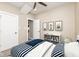 A cozy bedroom enhanced with striped bedding and whimsical animal-themed artwork at 1921 N Dexter St, Indianapolis, IN 46202