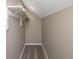 Well-lit walk-in closet with carpeted floor, rod for hanging clothes, and neutral wall color at 1921 N Dexter St, Indianapolis, IN 46202