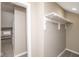 Bright closet with neutral walls, carpeted floor, and a rod for hanging clothes at 1921 N Dexter St, Indianapolis, IN 46202