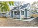 Charming home featuring stone accents, fresh landscaping, and a welcoming front porch at 1921 N Dexter St, Indianapolis, IN 46202