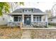 Inviting covered porch with stone base, providing a cozy and relaxing space at 1921 N Dexter St, Indianapolis, IN 46202