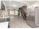Bright open space with fireplace connects the kitchen and living room area, enhancing the home's appeal at 1921 N Dexter St, Indianapolis, IN 46202