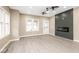 A bright and open living room with new flooring and a view of an electric fireplace at 1921 N Dexter St, Indianapolis, IN 46202