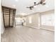 Inviting living room with wood-look floors, ceiling fans, and natural light creates a warm and welcoming atmosphere at 1921 N Dexter St, Indianapolis, IN 46202