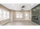 Contemporary living room featuring wood-look floors, fireplace, ample natural light, and neutral color palette at 1921 N Dexter St, Indianapolis, IN 46202