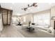 Open-concept living room showcasing light-colored vinyl floors and new kitchen with island at 1921 N Dexter St, Indianapolis, IN 46202