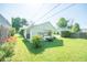 Spacious backyard view featuring a one car garage and connected carport at 1932 Central Ave, Columbus, IN 47201