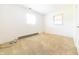 A bedroom with carpet flooring, white walls, and two windows for ample natural light at 1932 Central Ave, Columbus, IN 47201