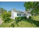 Side view of a classic home, featuring well-kept greenery and vintage charm at 1932 Central Ave, Columbus, IN 47201