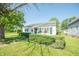 Charming home featuring a well-manicured front yard and classic architectural details at 1932 Central Ave, Columbus, IN 47201