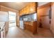 Functional kitchen with wooden cabinets and classic appliances, ready for your personal touch at 1932 Central Ave, Columbus, IN 47201