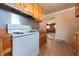 Practical kitchen with vintage range and wooden cabinets, offering a cozy cooking space at 1932 Central Ave, Columbus, IN 47201