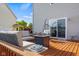 Beautiful backyard deck featuring a comfy outdoor seating area, a fire table, and nearby water access at 1969 Westminster Pl, Columbus, IN 47201