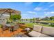 Enjoy the backyard views from this beautiful deck, complete with a lake, seating, and an umbrella table at 1969 Westminster Pl, Columbus, IN 47201