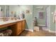 Well-lit bathroom featuring a single sink vanity with light wood cabinets at 1969 Westminster Pl, Columbus, IN 47201