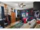 Spacious bedroom with sports-themed decor, carpet floors, and a large window at 1969 Westminster Pl, Columbus, IN 47201