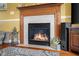 Detailed view of the fireplace, showing the tiled surround and hearth at 1969 Westminster Pl, Columbus, IN 47201