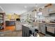 Bright kitchen featuring an island, stainless steel appliances, and views into the living room at 1969 Westminster Pl, Columbus, IN 47201