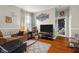 Inviting living room showcasing hardwood floors, soft lighting, and comfortable seating at 1969 Westminster Pl, Columbus, IN 47201