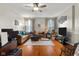 Open living room featuring hardwood floors, neutral paint, and large windows for natural light at 1969 Westminster Pl, Columbus, IN 47201