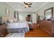 Spacious main bedroom featuring a comfortable bed, neutral decor, and hardwood floors at 1969 Westminster Pl, Columbus, IN 47201