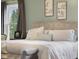 Inviting main bedroom showcasing a comfortable bed, tranquil decor, and a large window at 1969 Westminster Pl, Columbus, IN 47201