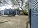 View of the backyard with concrete, grassy areas, and home exteriors, all contained by a fence at 2324 E 36Th St, Indianapolis, IN 46218