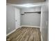 Basement featuring wood-look flooring and white trim at 2324 E 36Th St, Indianapolis, IN 46218