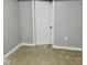Bedroom with carpeting and a closet with a white door at 2324 E 36Th St, Indianapolis, IN 46218