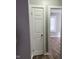 Hallway closet with modern doors leading to a living area with lots of light at 2324 E 36Th St, Indianapolis, IN 46218