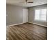 Bright living area featuring laminated floors, a new entrance door and white trim at 2324 E 36Th St, Indianapolis, IN 46218
