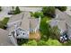 Two-story house with private wood deck and lush landscaping nestled in a serene, well-maintained neighborhood at 2829 Somerset Bay, Indianapolis, IN 46240