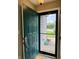 Inviting home entryway showcasing green front door, offering a glimpse into comfortable interior at 2829 Somerset Bay, Indianapolis, IN 46240