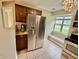 Corner kitchen with stainless steel appliances, a window over the bench, and a chandelier at 2829 Somerset Bay, Indianapolis, IN 46240