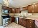 Well-appointed kitchen with stainless appliances, tiled backsplash, and ample counter space at 2829 Somerset Bay, Indianapolis, IN 46240