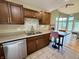 Eat-in kitchen boasts stainless steel appliances, ample cabinetry, and flows into the living room at 2829 Somerset Bay, Indianapolis, IN 46240