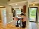 Updated kitchen with stainless steel appliances and breakfast bar with pink upholstered chairs at 2829 Somerset Bay, Indianapolis, IN 46240