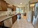 Charming kitchen with stainless steel appliances and an open view to the dining and living area at 2829 Somerset Bay, Indianapolis, IN 46240